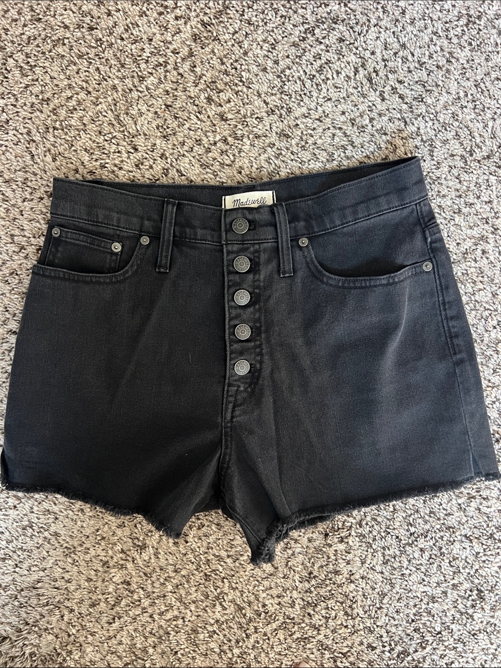 EUC Madewell High Rise Cut Off Shorts. Size 29. Color is a faded black.